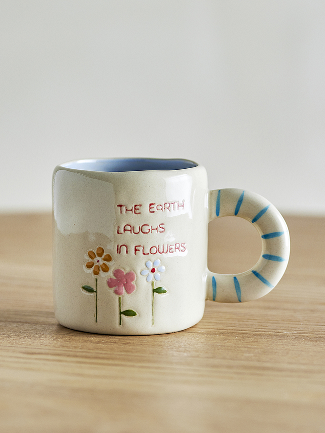 Cloudy Tasse The earth laughs in flowers