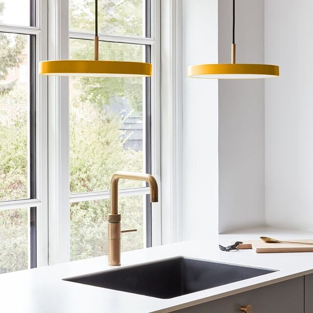 Asteria lamp by Umage in a beautiful mustard color