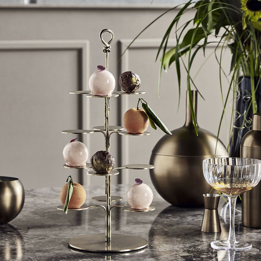 Expositor de Pisos Seny, de latón envejecido