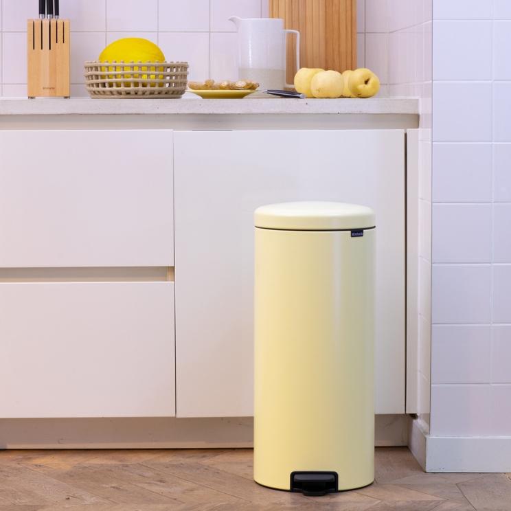butter-colored waste bin