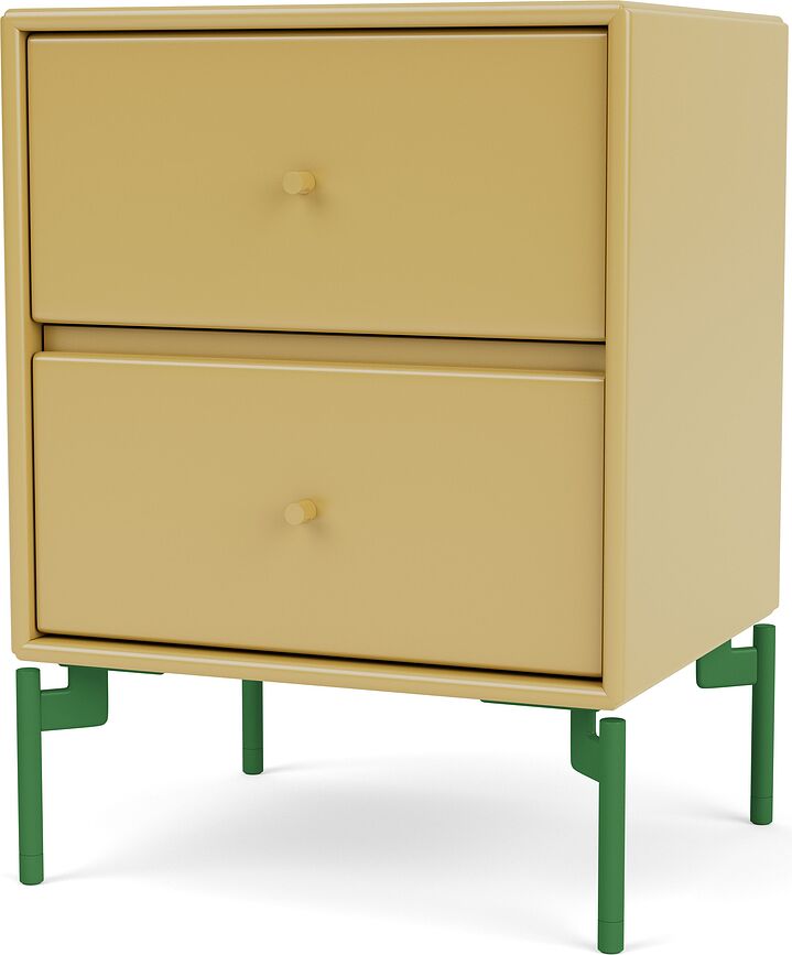 Drift Nachtschrank senffarbig auf grünen Beinen