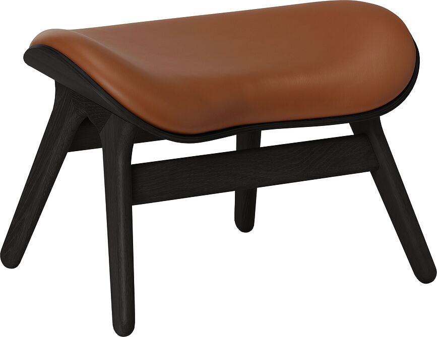 Podnóżek Conversation Piece Hope koniakowy skórzany na czarnych dębowych nogach